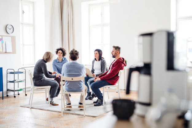 los angeles heroin detox a group of people sit in a circle for therapy in a los angeles heroin detox