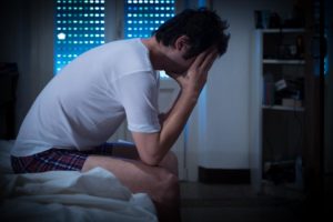 man struggling with heroin withdrawal symptoms